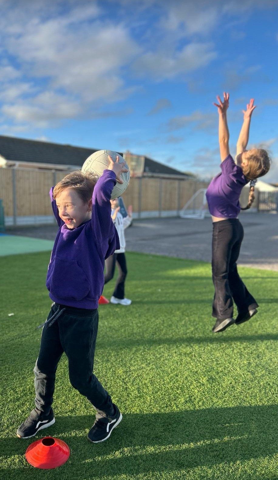 Children playing on the sports field at Shoreham Beach Primary School