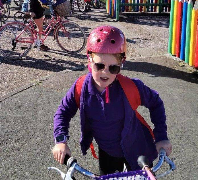A pupil riding in with the bike bus